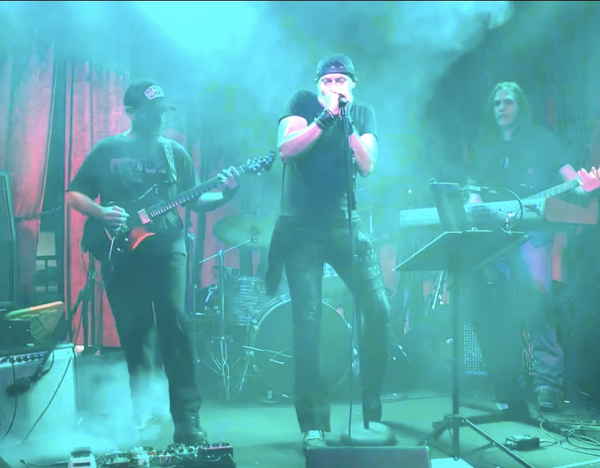 Four piece rock cover band performing onstage at an event | Altus Entertainment